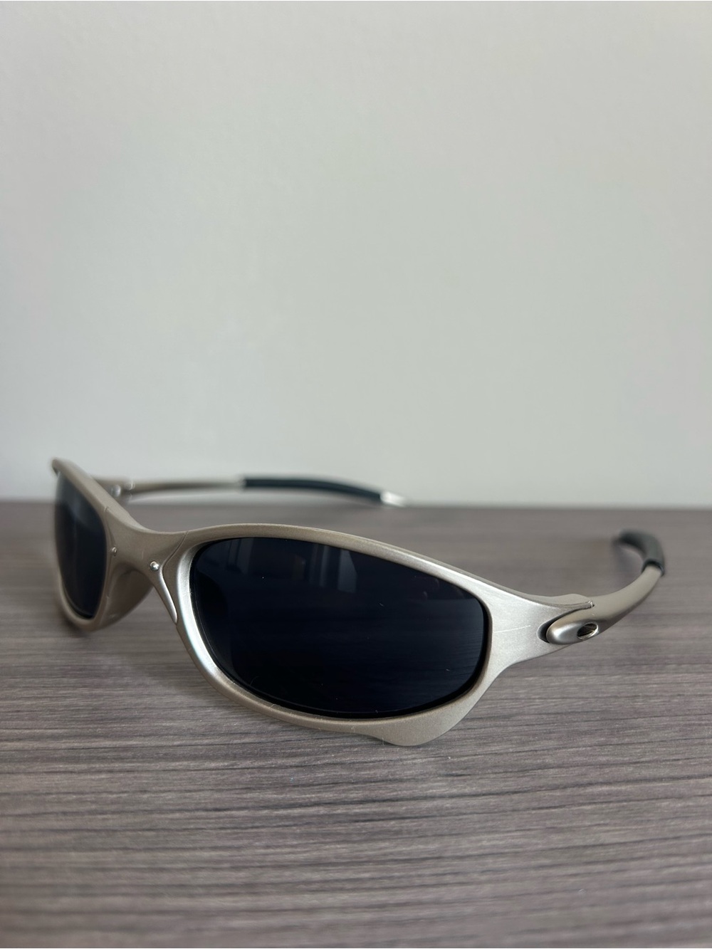 Oakley Men's Silver Frame Sunglasses with Black Lenses